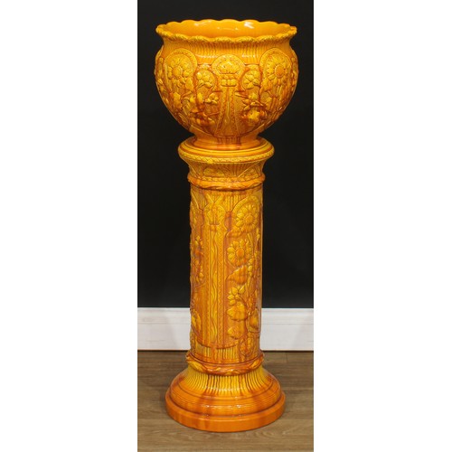 824 - A Burmantoft jardiniere and stand, yellow and orange glaze, 94.5cm high