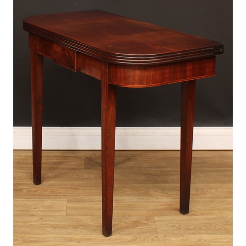 429 - A George IV mahogany D-shaped tea table, hinged top with channelled edge, above a deep frieze centre... 