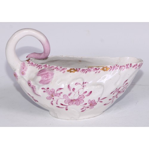 675 - A Derby Cos Lettuce sauce boat, decorated in tones of pink with flowering sprigs picked out in gilt,... 