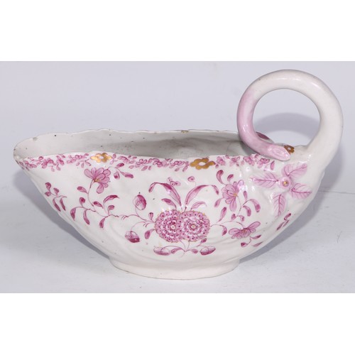 675 - A Derby Cos Lettuce sauce boat, decorated in tones of pink with flowering sprigs picked out in gilt,... 