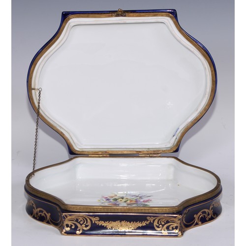 384 - A Continental gilt metal mountede porcelain casket, decorated in polychrome with a musical trophy, t... 