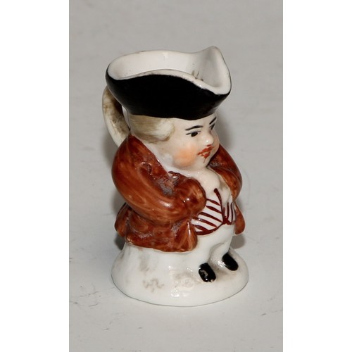 793 - A Sampson Hancock Derby miniature toby jug, 4.5cm high, red mark; others, similar (6)