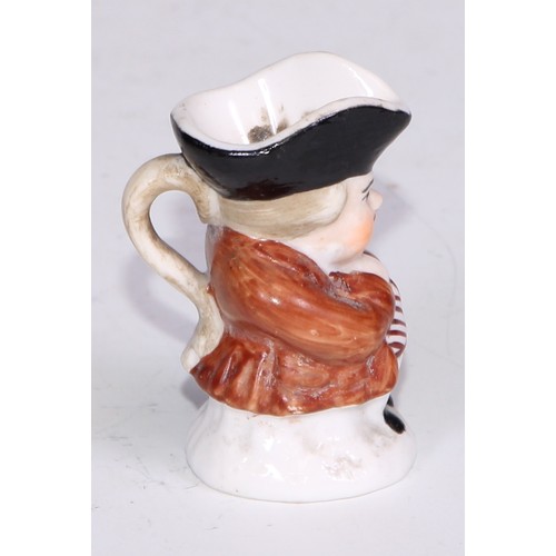 793 - A Sampson Hancock Derby miniature toby jug, 4.5cm high, red mark; others, similar (6)