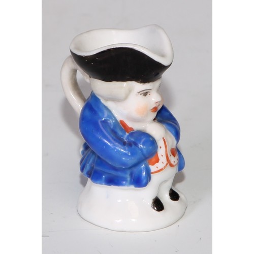 793 - A Sampson Hancock Derby miniature toby jug, 4.5cm high, red mark; others, similar (6)