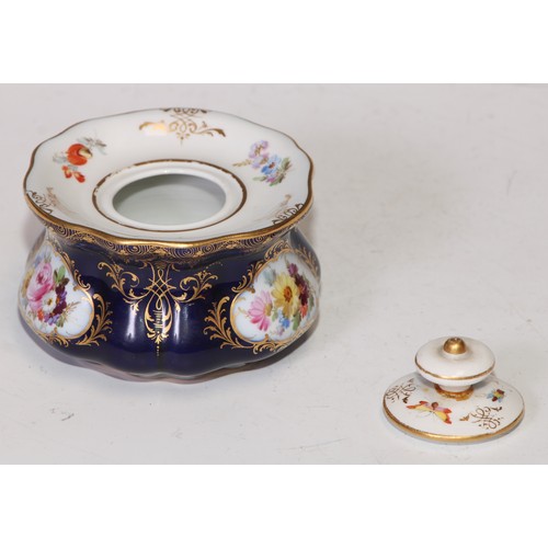 737 - A Meissen lobed circular inkwell and cover, decorated with reserves of summer flowers, picked out in... 