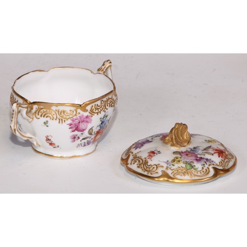 727 - A Continental porcelain chocolate cup and stand, decorated with flowers and outlined with bands of r... 