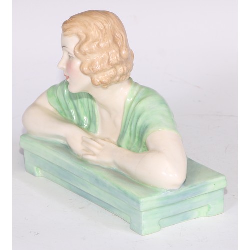 748 - A Royal Doulton bust length figure, Gladys, modelled as a young Art Deco lady leaning on a ledge, 17... 