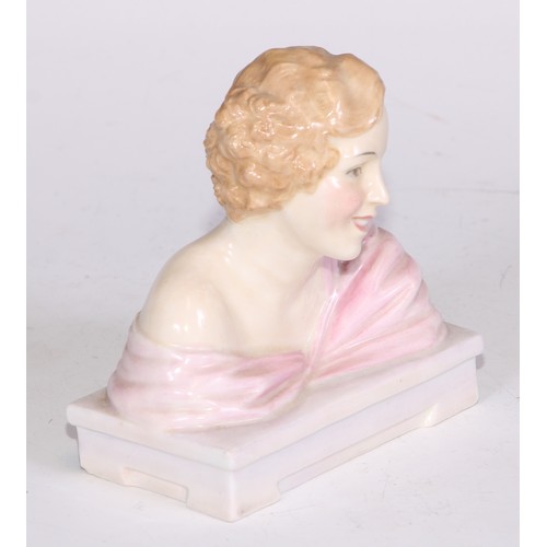 748 - A Royal Doulton bust length figure, Gladys, modelled as a young Art Deco lady leaning on a ledge, 17... 