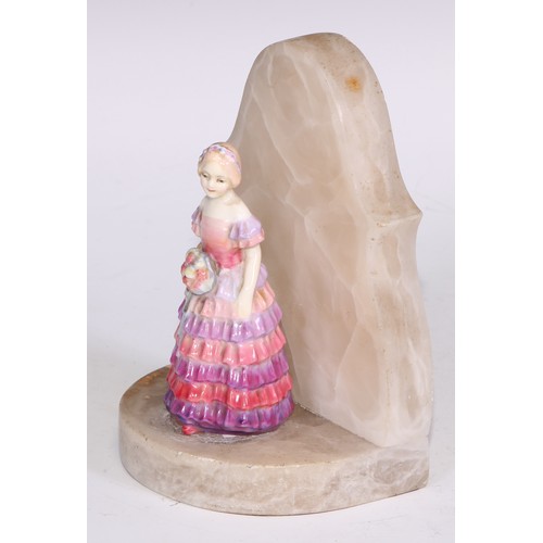 748 - A Royal Doulton bust length figure, Gladys, modelled as a young Art Deco lady leaning on a ledge, 17... 