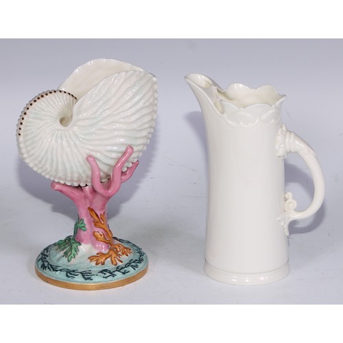 814 - A Royal Worcester vase, naturalistically modelled as a nautilus shell upon a coral specimen, 16cm hi... 