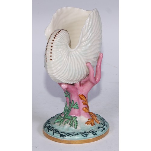 814 - A Royal Worcester vase, naturalistically modelled as a nautilus shell upon a coral specimen, 16cm hi... 