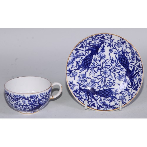 595 - A Derby Crown Porcelain tea service, printed in tones of underglaze blue, the lobed oval tray 45cm w... 