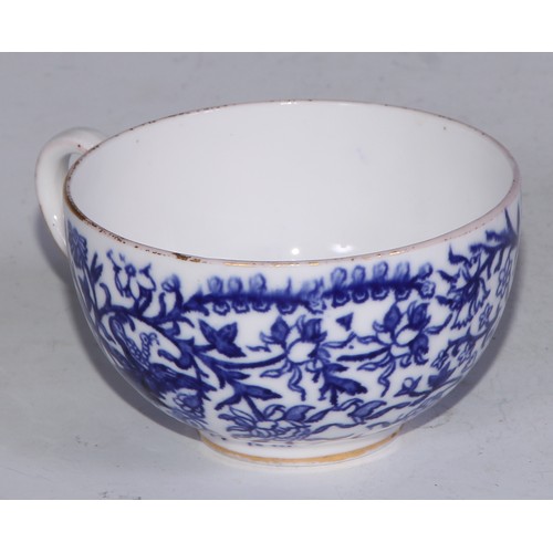 595 - A Derby Crown Porcelain tea service, printed in tones of underglaze blue, the lobed oval tray 45cm w... 