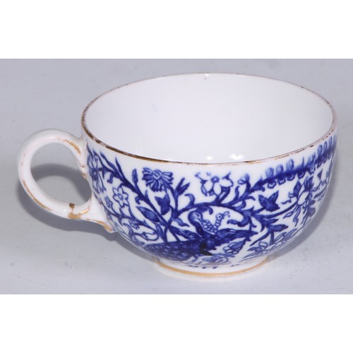 595 - A Derby Crown Porcelain tea service, printed in tones of underglaze blue, the lobed oval tray 45cm w... 