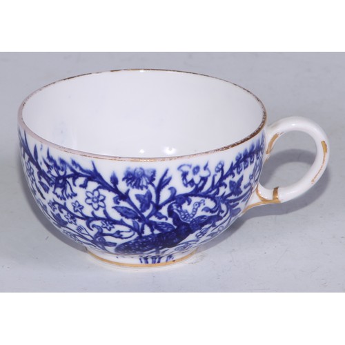 595 - A Derby Crown Porcelain tea service, printed in tones of underglaze blue, the lobed oval tray 45cm w... 