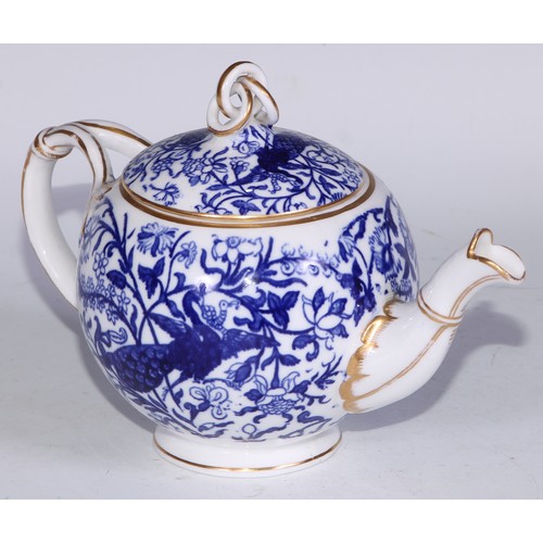 595 - A Derby Crown Porcelain tea service, printed in tones of underglaze blue, the lobed oval tray 45cm w... 