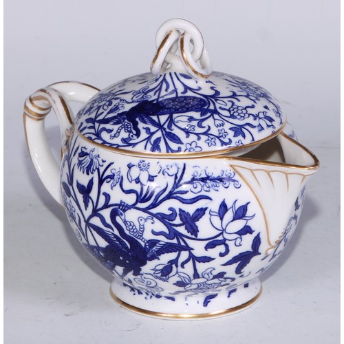 595 - A Derby Crown Porcelain tea service, printed in tones of underglaze blue, the lobed oval tray 45cm w... 