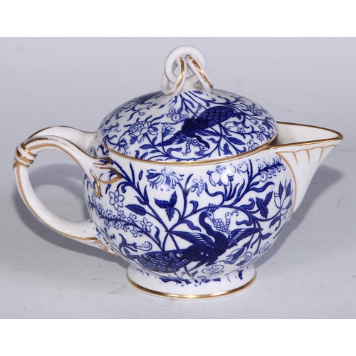 595 - A Derby Crown Porcelain tea service, printed in tones of underglaze blue, the lobed oval tray 45cm w... 