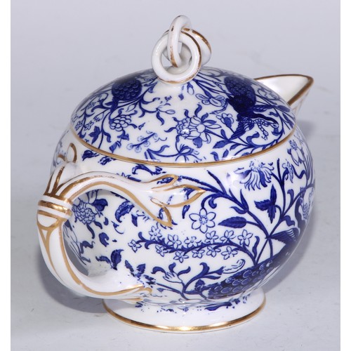 595 - A Derby Crown Porcelain tea service, printed in tones of underglaze blue, the lobed oval tray 45cm w... 