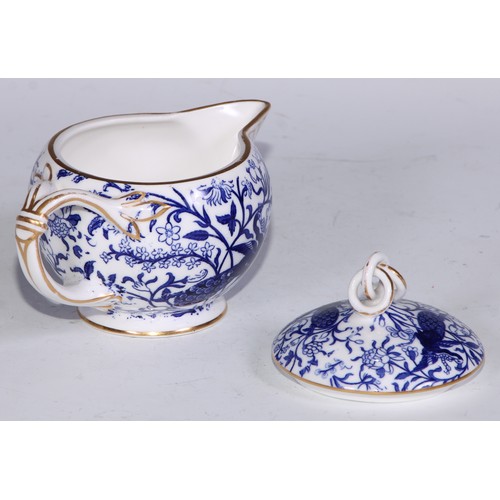 595 - A Derby Crown Porcelain tea service, printed in tones of underglaze blue, the lobed oval tray 45cm w... 