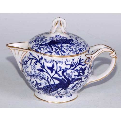 595 - A Derby Crown Porcelain tea service, printed in tones of underglaze blue, the lobed oval tray 45cm w... 