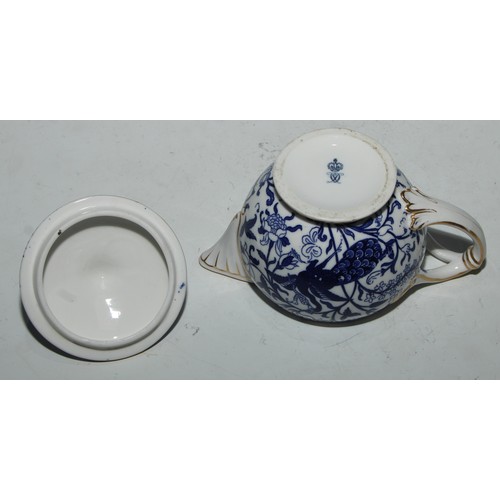 595 - A Derby Crown Porcelain tea service, printed in tones of underglaze blue, the lobed oval tray 45cm w... 