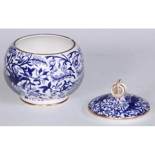 595 - A Derby Crown Porcelain tea service, printed in tones of underglaze blue, the lobed oval tray 45cm w... 