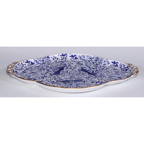 595 - A Derby Crown Porcelain tea service, printed in tones of underglaze blue, the lobed oval tray 45cm w... 