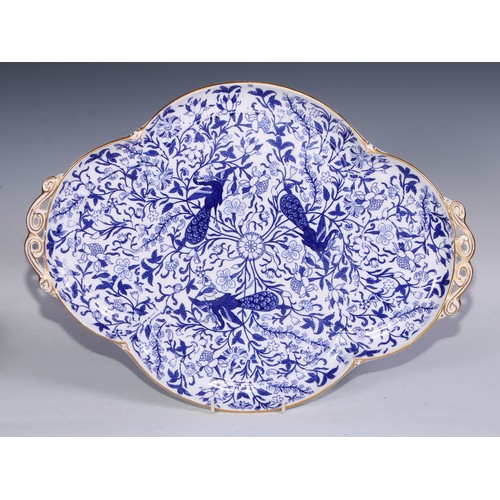 595 - A Derby Crown Porcelain tea service, printed in tones of underglaze blue, the lobed oval tray 45cm w... 