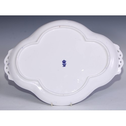 595 - A Derby Crown Porcelain tea service, printed in tones of underglaze blue, the lobed oval tray 45cm w... 