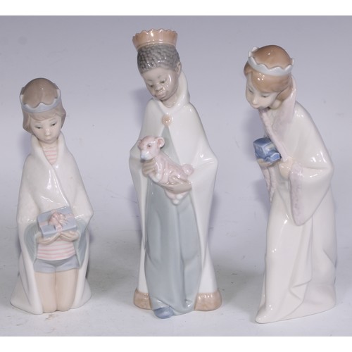 826 - A Lladro figure, Boy with Crown, 21cm high, boxed; others (3)