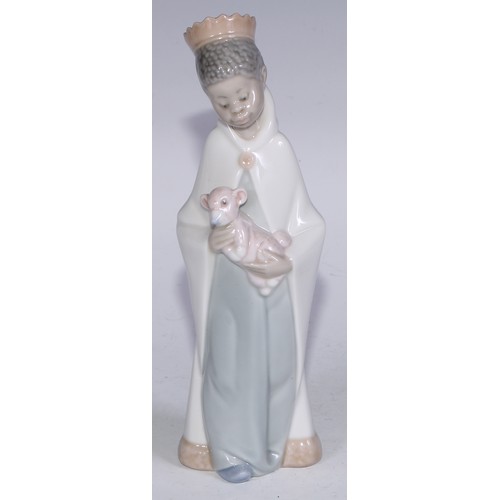 826 - A Lladro figure, Boy with Crown, 21cm high, boxed; others (3)