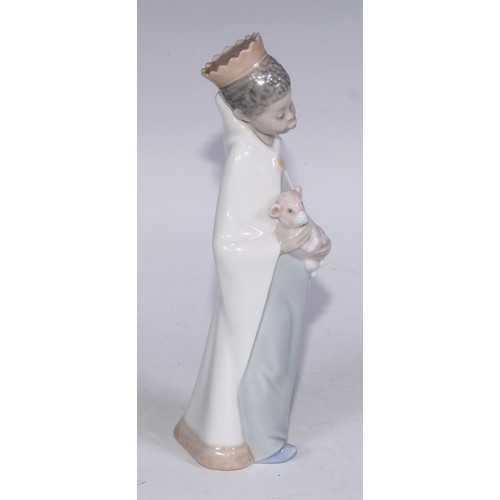 826 - A Lladro figure, Boy with Crown, 21cm high, boxed; others (3)