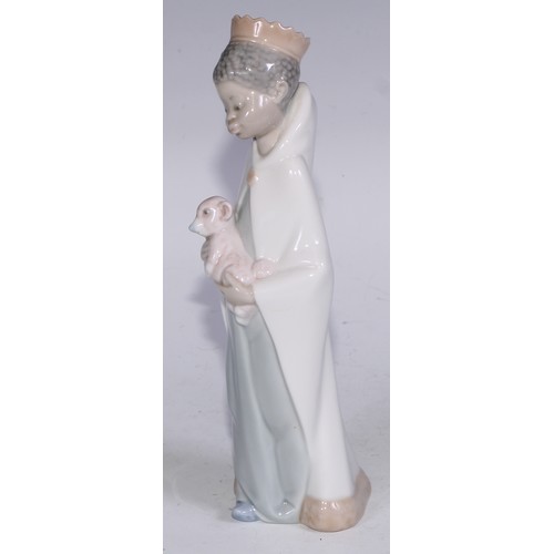 826 - A Lladro figure, Boy with Crown, 21cm high, boxed; others (3)