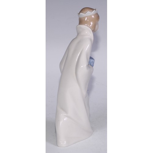 826 - A Lladro figure, Boy with Crown, 21cm high, boxed; others (3)