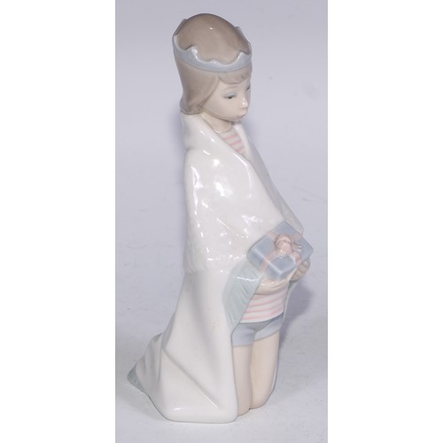 826 - A Lladro figure, Boy with Crown, 21cm high, boxed; others (3)