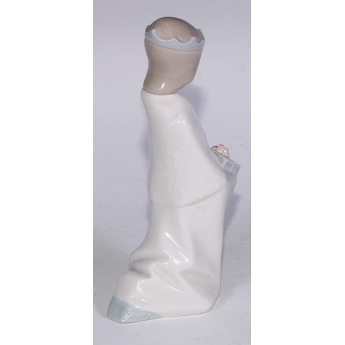 826 - A Lladro figure, Boy with Crown, 21cm high, boxed; others (3)