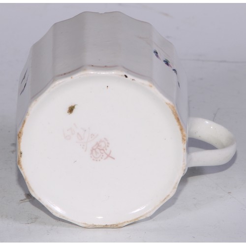 669 - A Derby armorial helmet shaped cream jug, printed in monochrome with a heraldic crest, 15cm long, c.... 