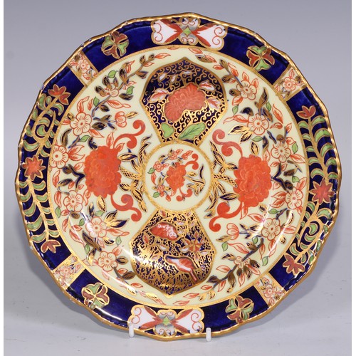 632 - A Royal Crown Derby dessert service, comprising a comport, two sihes and nine plates, decorated in t... 