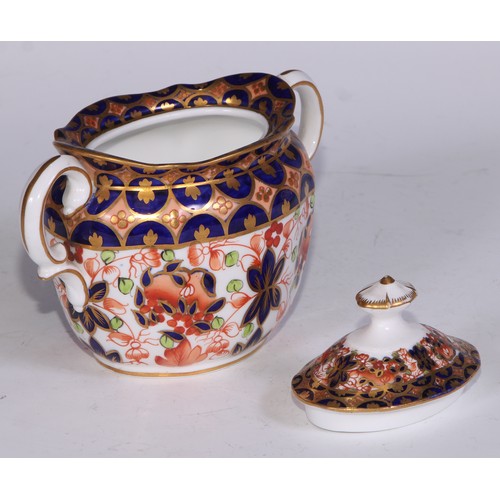 638 - A Royal Crown Derby Imari sucrier and cover, 15cm wide, printed mark; an 1128 pattern tea cup; a 245... 