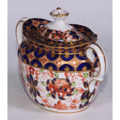 638 - A Royal Crown Derby Imari sucrier and cover, 15cm wide, printed mark; an 1128 pattern tea cup; a 245... 