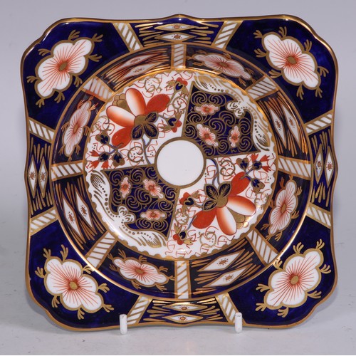 638 - A Royal Crown Derby Imari sucrier and cover, 15cm wide, printed mark; an 1128 pattern tea cup; a 245... 