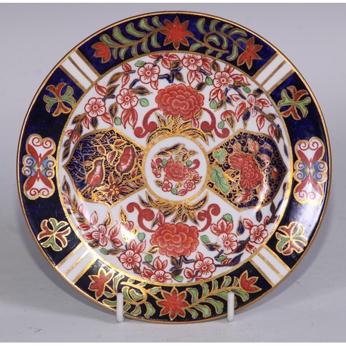 638 - A Royal Crown Derby Imari sucrier and cover, 15cm wide, printed mark; an 1128 pattern tea cup; a 245... 