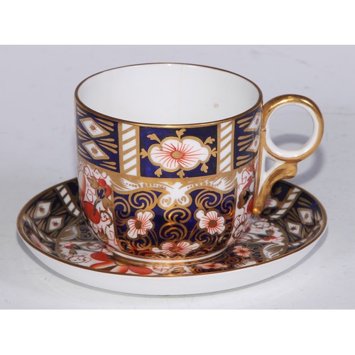 638 - A Royal Crown Derby Imari sucrier and cover, 15cm wide, printed mark; an 1128 pattern tea cup; a 245... 