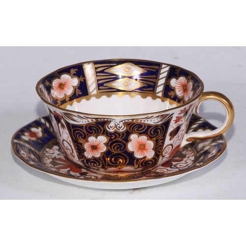 638 - A Royal Crown Derby Imari sucrier and cover, 15cm wide, printed mark; an 1128 pattern tea cup; a 245... 