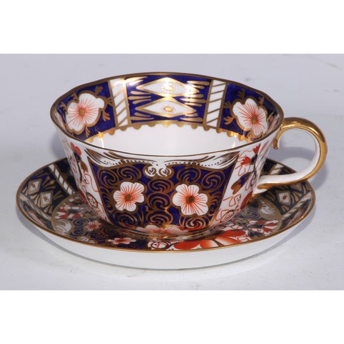 638 - A Royal Crown Derby Imari sucrier and cover, 15cm wide, printed mark; an 1128 pattern tea cup; a 245... 