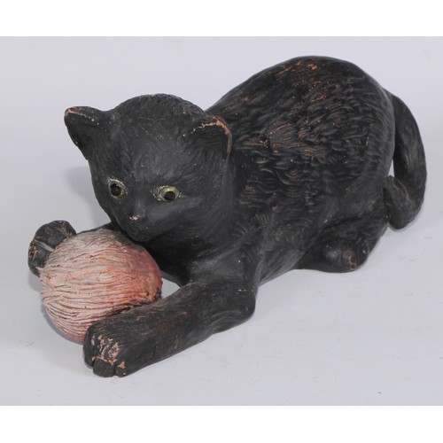 760 - Ceramics - a Bretby model of a cat, modelled with a ball, impressed mark; a 19th century beer jug, B... 