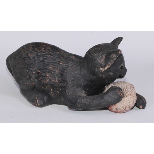 760 - Ceramics - a Bretby model of a cat, modelled with a ball, impressed mark; a 19th century beer jug, B... 