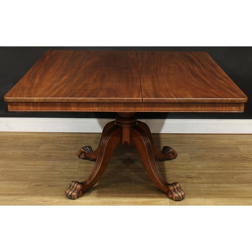 468 - A mahogany breakfast table, rounded rectangular titling top, turned column, reeded legs, paw feet, 7... 