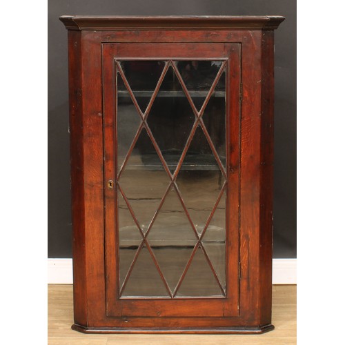 424 - A George III oak splay front corner display cabinet, 124cm high, 84.5cm wide, 46cm deep; another, 11... 